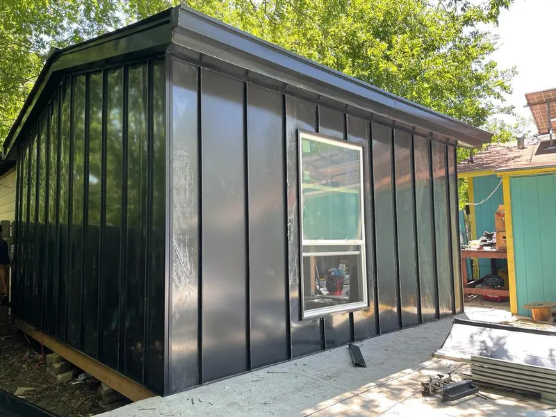 Black standing seam metal wall panels for Roof Inspection in Prospect