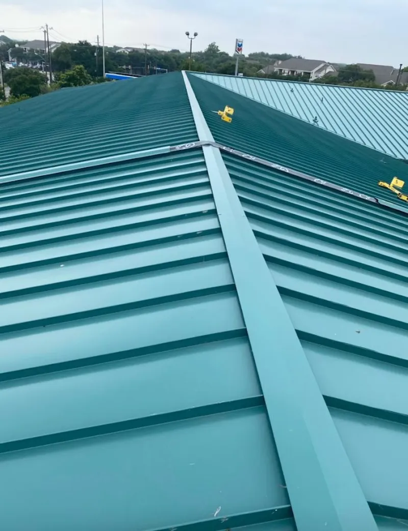 Green commercial metal roof ridge and valley for Metal Roof Repair in Prospect